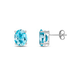 9ct White Gold Oval Natural Swiss Blue Topaz Claw Stud Earrings — 9x7mm