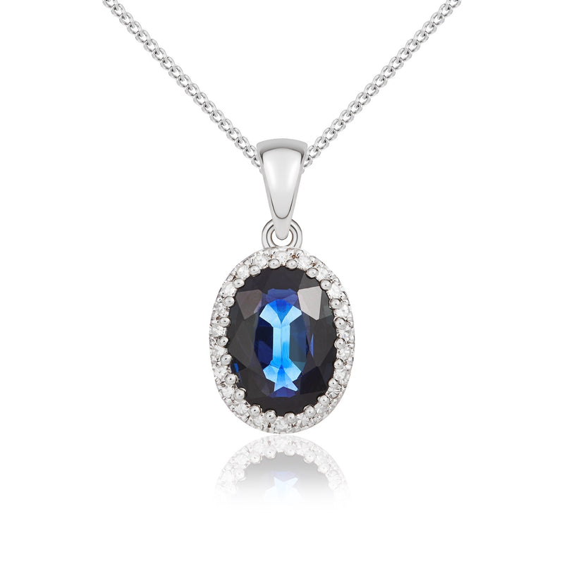 18ct White Gold Oval Natural Sapphire & Diamond Claw Set Cluster Pendant — 7x5mm