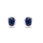 9ct White Gold Oval Natural Sapphire Rubover Stud Earrings — 4x3mm