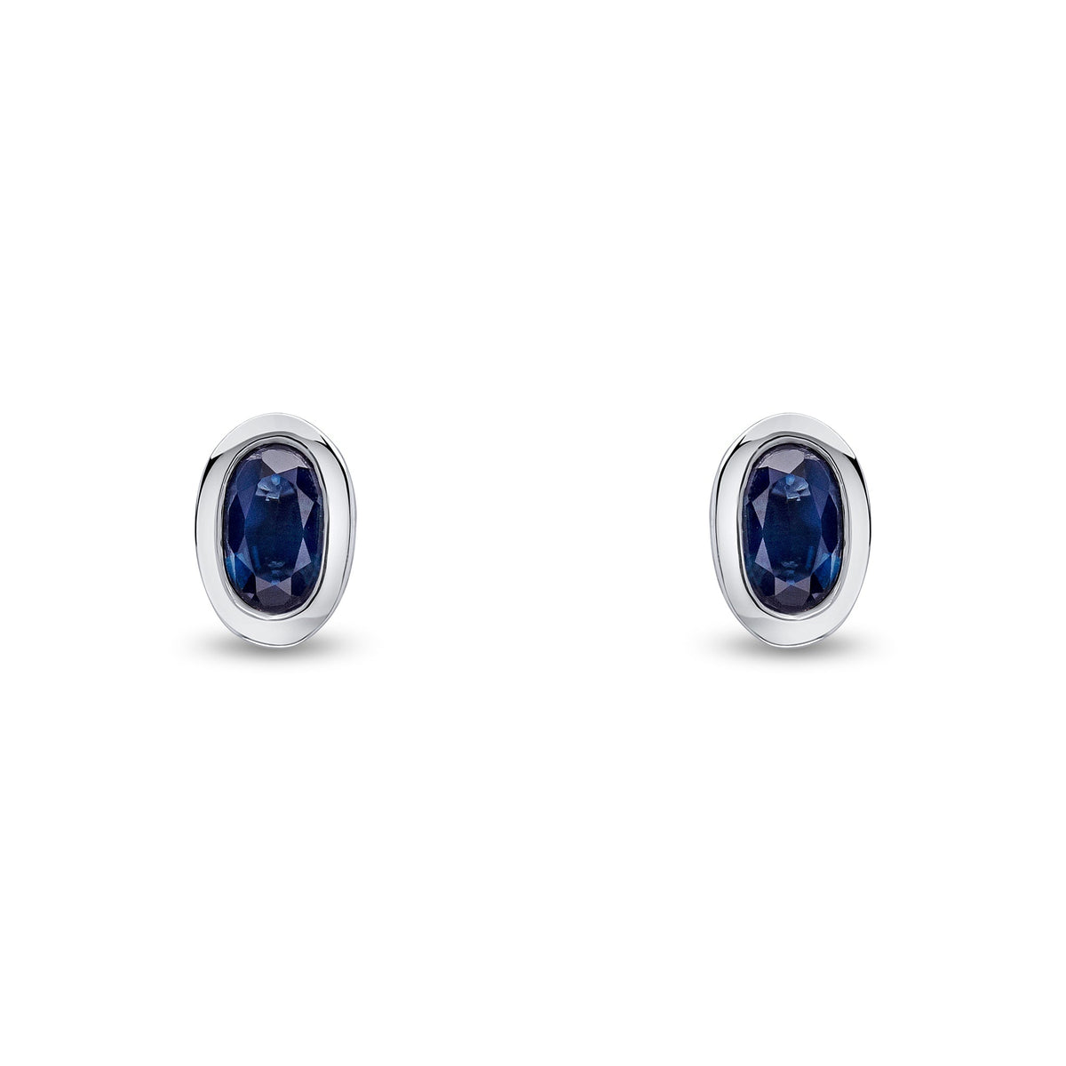 9ct White Gold Oval Natural Sapphire Rubover Stud Earrings — 5x3mm
