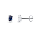 9ct White Gold Oval Natural Sapphire Rubover Stud Earrings — 5x3mm