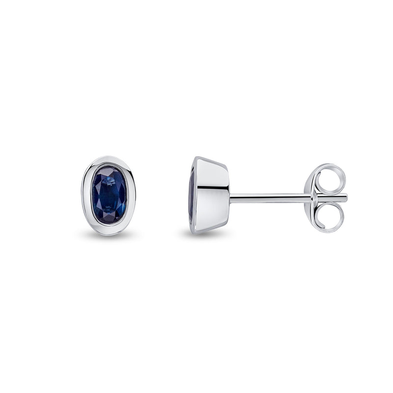 9ct White Gold Oval Natural Sapphire Rubover Stud Earrings — 5x3mm