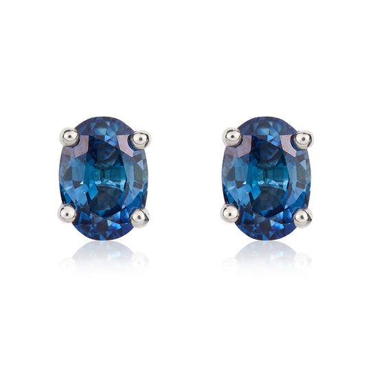 9ct White Gold Oval Natural Blue Sapphire Claw Stud Earrings — 7x5mm