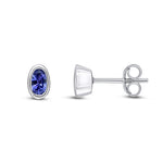 9ct White Gold Oval Natural Tanzanite Rubover Stud Earrings — 5x3mm