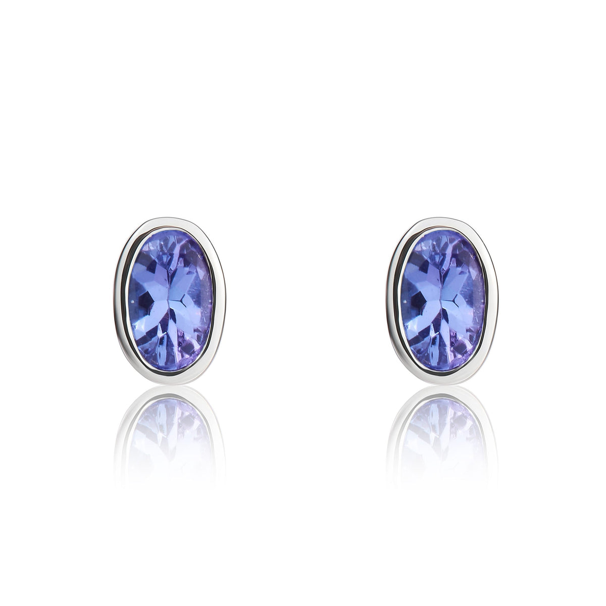 9ct White Gold Oval Natural Tanzanite Rubover Stud Earrings — 4x3mm