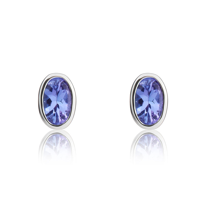 9ct White Gold Oval Natural Tanzanite Rubover Stud Earrings — 4x3mm
