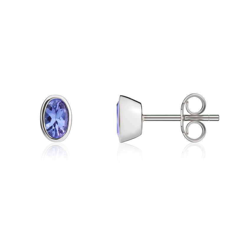 9ct White Gold Oval Natural Tanzanite Rubover Stud Earrings — 4x3mm