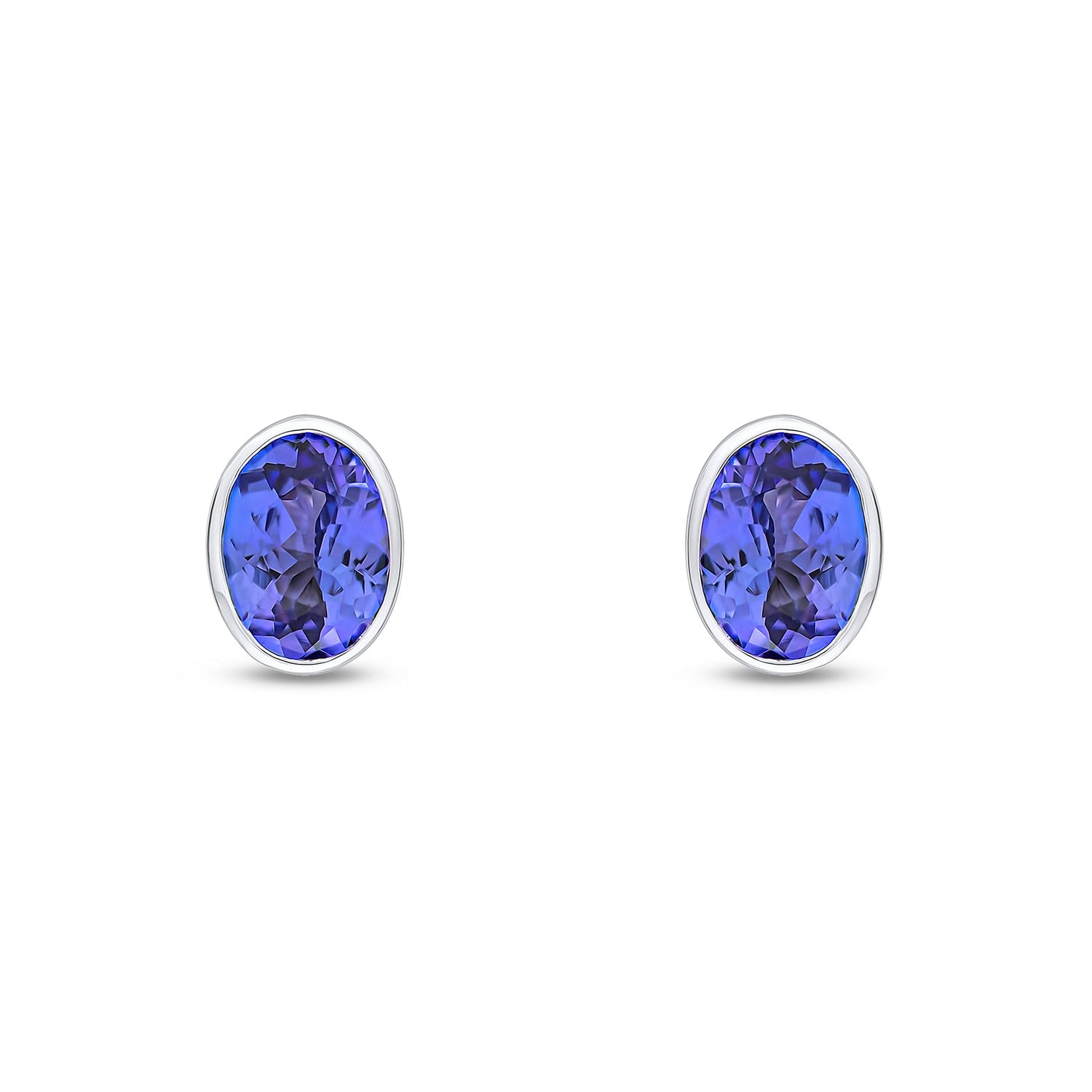 9ct White Gold Oval Natural Tanzanite Rubover Stud Earrings — 7x5mm