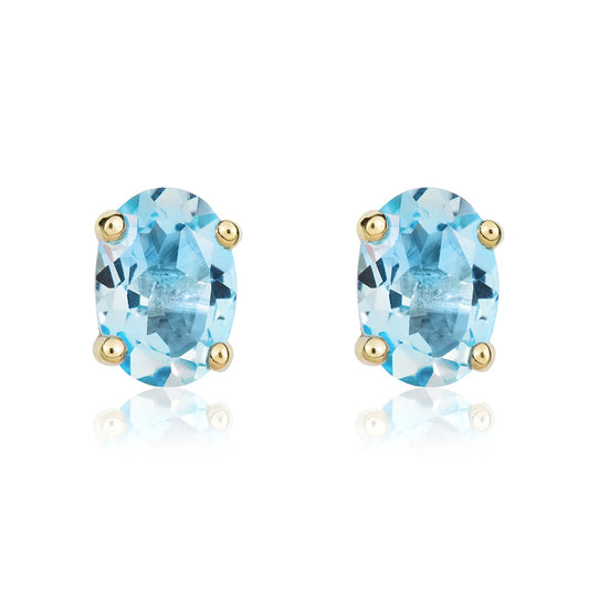 9ct Yellow Gold Oval Natural Swiss Blue Topaz Claw Set Stud Earrings — 7x5mm