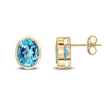 9ct Yellow Gold Oval Natural Swiss Blue Topaz Rubover Stud Earrings — 9x7mm