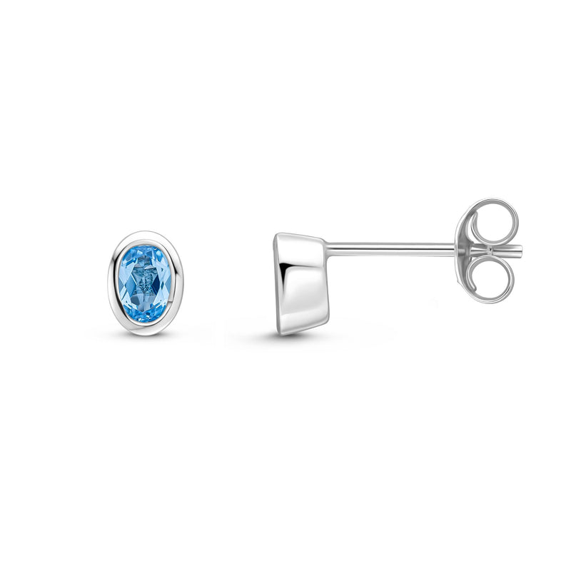 9ct White Gold Oval Natural Swiss Blue Topaz Rubover Stud Earrings — 4x3mm