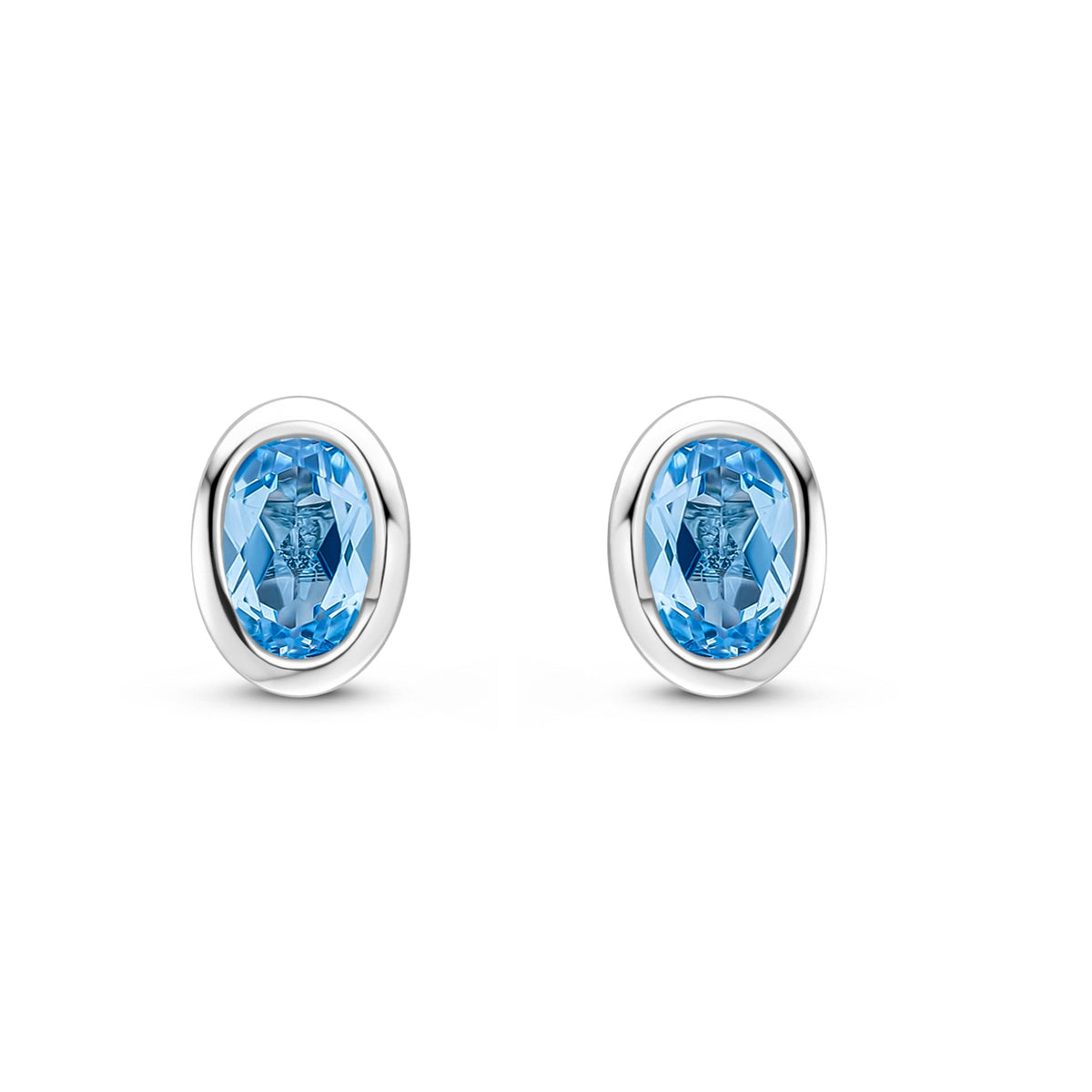 9ct White Gold Oval Natural Swiss Blue Topaz Rubover Stud Earrings — 4x3mm