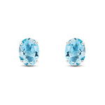 9ct White Gold Oval Natural Swiss Blue Topaz Claw Stud Earrings — 8x6mm