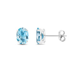 9ct White Gold Oval Natural Swiss Blue Topaz Claw Stud Earrings — 8x6mm