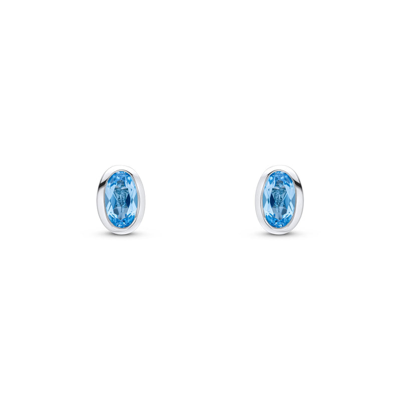 9ct White Gold Oval Natural Swiss Blue Topaz Rubover Stud Earrings — 5x3mm