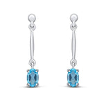 9ct White Gold Oval Natural Swiss Blue Topaz Claw Bar Drop Earrings — 6x4mm