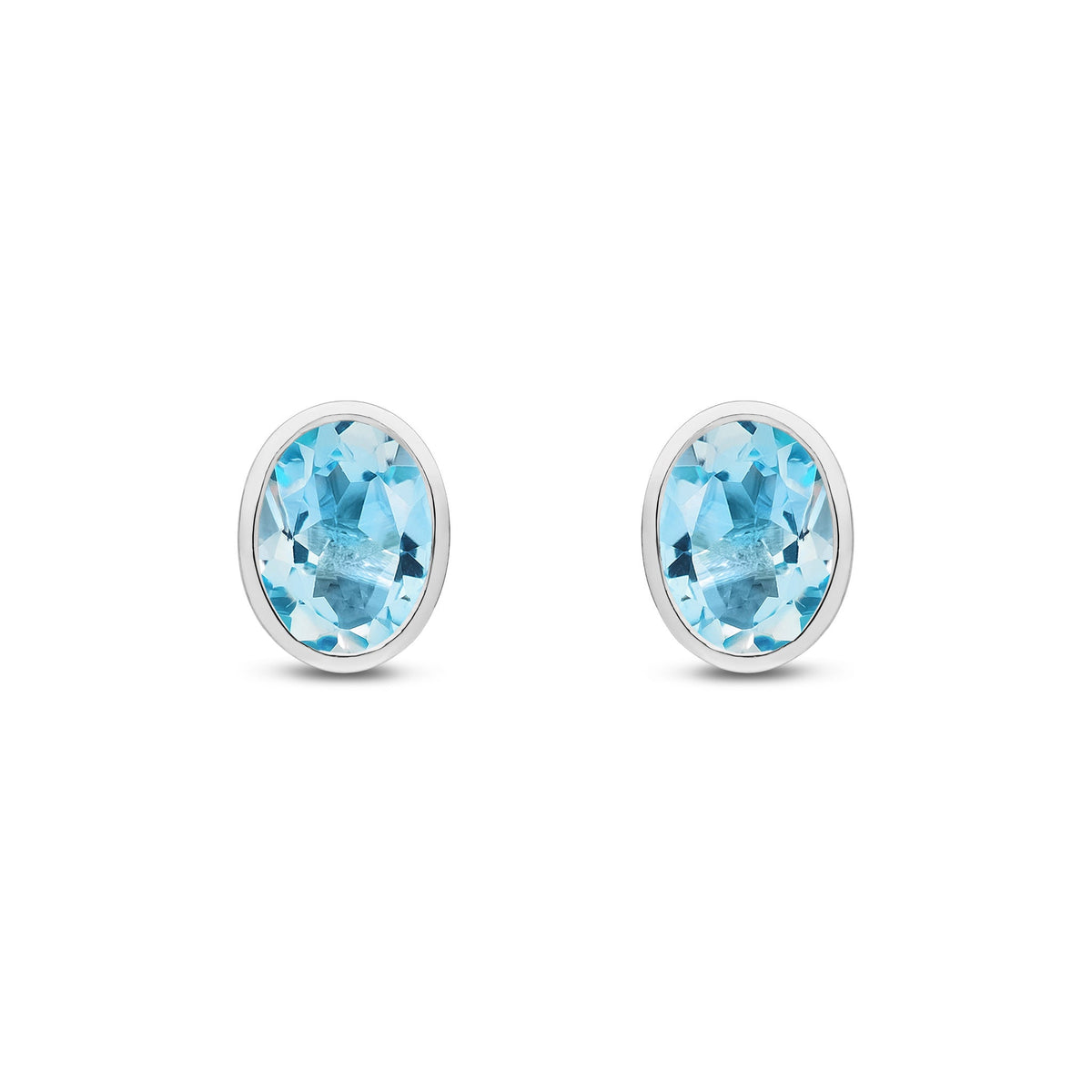 9ct White Gold Oval Natural Swiss Blue Topaz Rubover Stud Earrings — 8x6mm