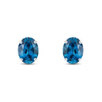 9ct White Gold Oval Natural London Blue Topaz Claw Stud Earrings — 8x6mm