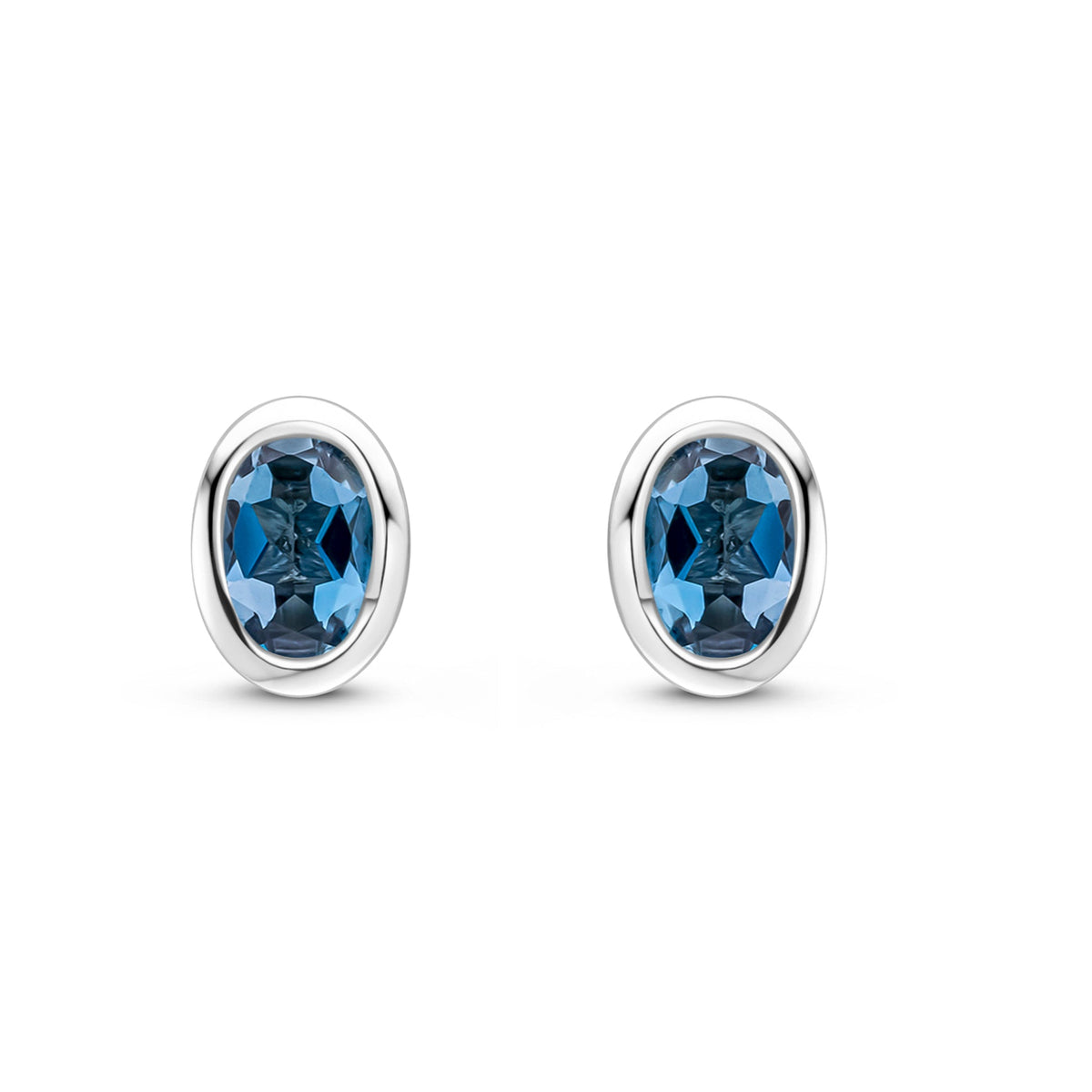 9ct White Gold Oval Natural London Blue Topaz Rubover Stud Earrings — 4x3mm