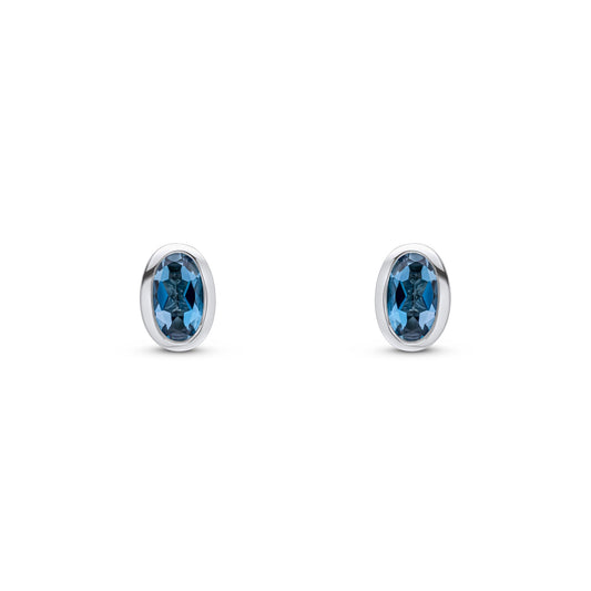 9ct White Gold Oval Natural London Blue Topaz Rubover Stud Earrings — 5x3mm