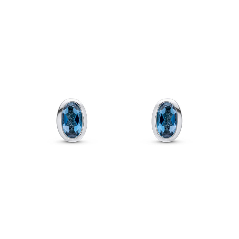 9ct White Gold Oval Natural London Blue Topaz Rubover Stud Earrings — 5x3mm