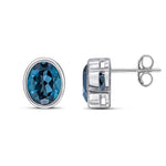 9ct White Gold Oval Natural London Blue Topaz Rubover Stud Earrings — 9x7mm