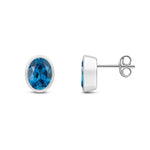 9ct White Gold Oval Natural London Blue Topaz Rubover Stud Earrings — 8x6mm