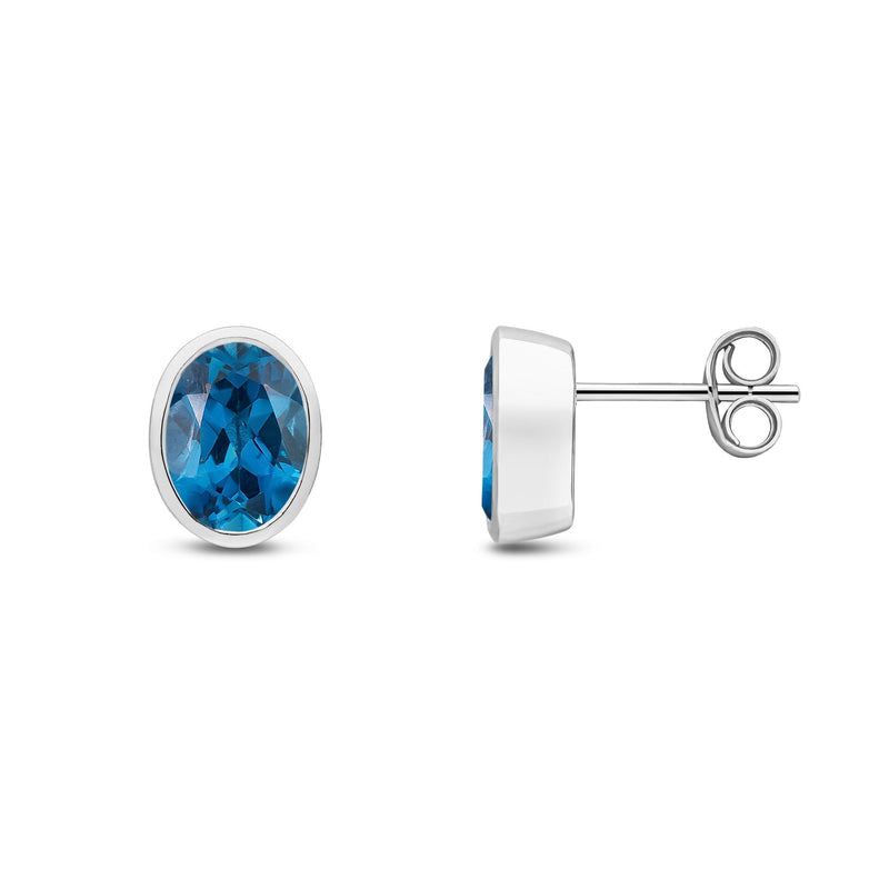 9ct White Gold Oval Natural London Blue Topaz Rubover Stud Earrings — 8x6mm