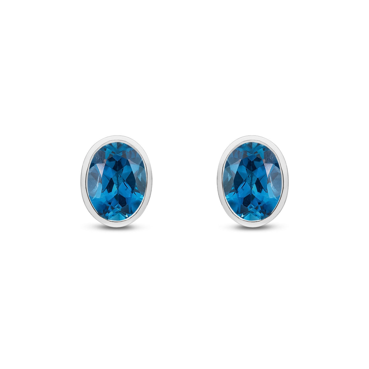 9ct White Gold Oval Natural London Blue Topaz Rubover Stud Earrings — 8x6mm