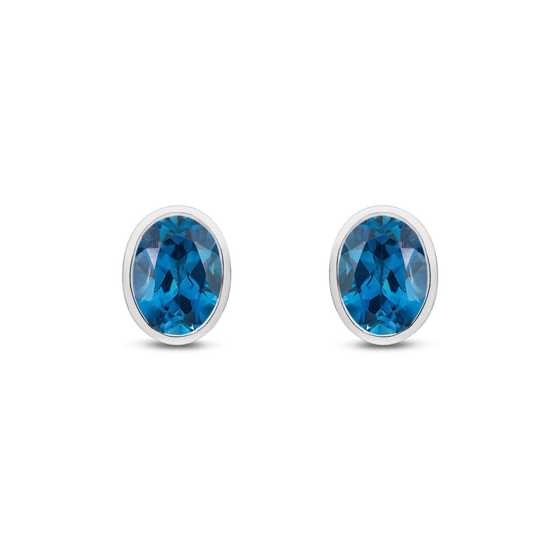 9ct White Gold Oval Natural London Blue Topaz Rubover Stud Earrings — 8x6mm