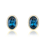 9ct Yellow Gold Oval Natural London Blue Topaz Rubover Stud Earrings — 6x4mm
