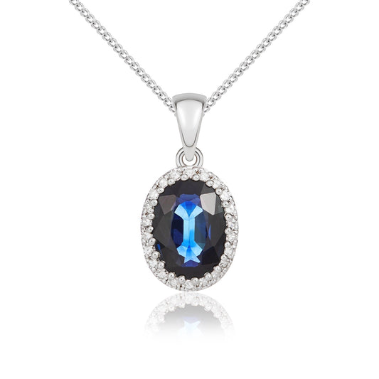 18ct White Gold Oval Natural Sapphire and Diamond Cluster Pendant — 7x5mm