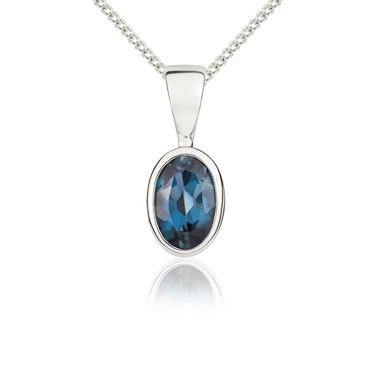 9ct White Gold Oval Natural London Blue Topaz Rubover Pendant — 6x4mm