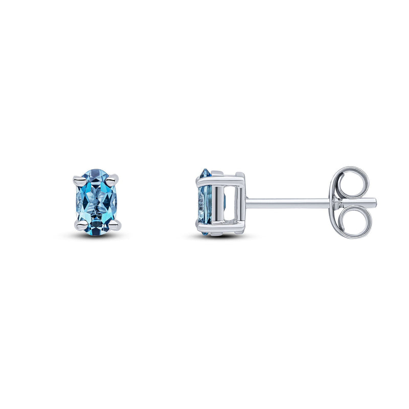 9ct White Gold Oval Natural London Blue Topaz Claw Stud Earrings — 5x3mm