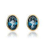 9ct Yellow Gold Oval Natural London Blue Topaz Rubover Stud Earrings — 7x5mm