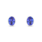 9ct White Gold Oval Natural Tanzanite Rubover Stud Earrings — 7x5mm