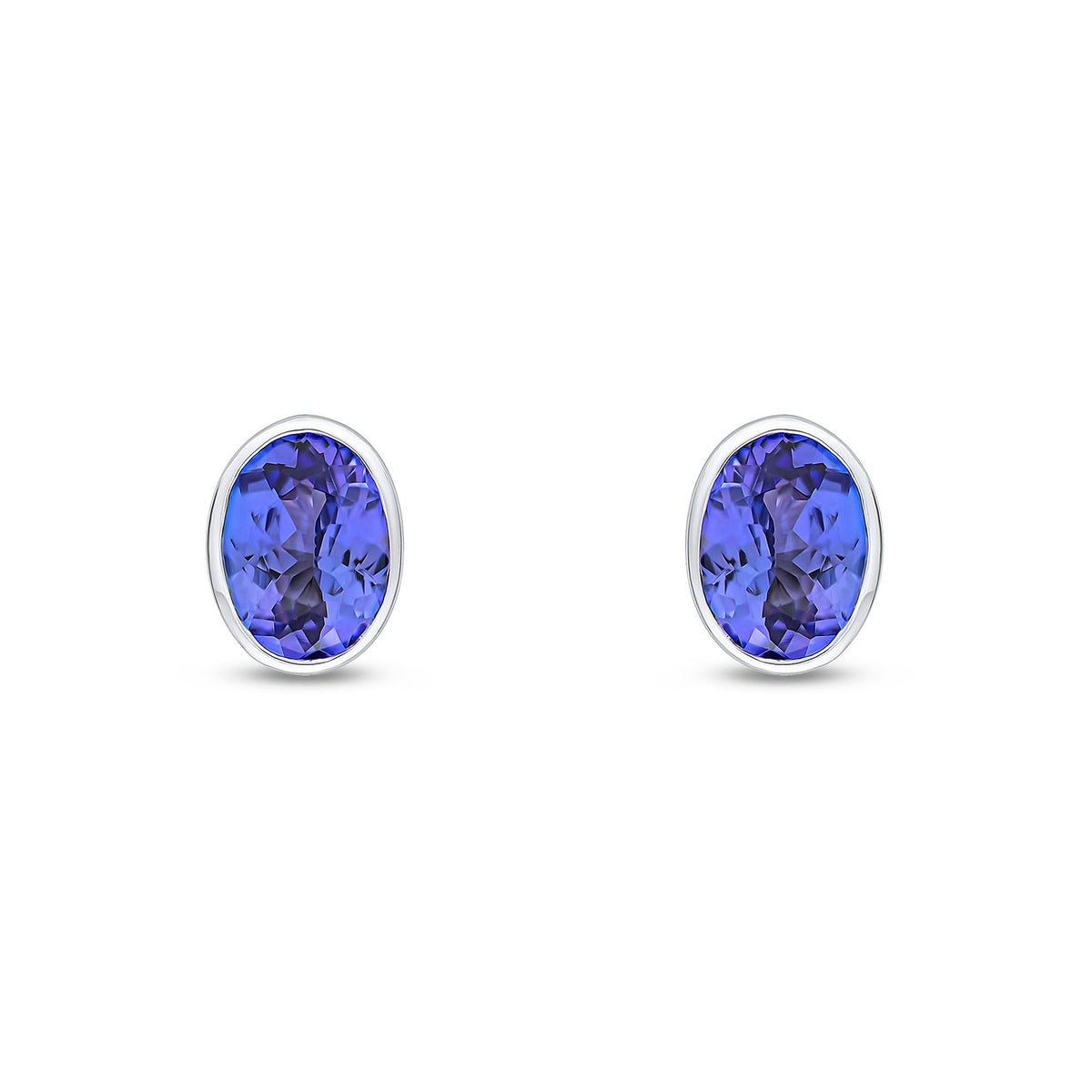 9ct White Gold Oval Natural Tanzanite Rubover Stud Earrings — 7x5mm