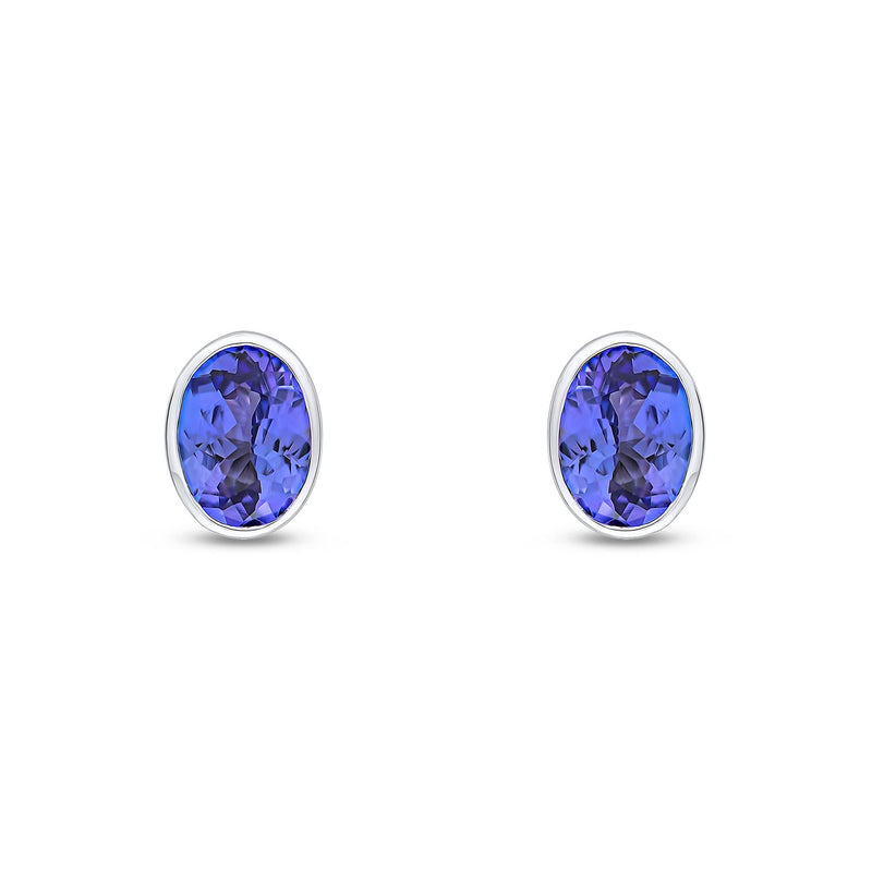 9ct White Gold Oval Natural Tanzanite Rubover Stud Earrings — 7x5mm