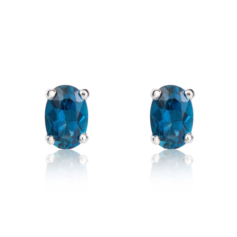 9ct White Gold Oval Natural London Blue Topaz Claw Stud Earrings — 6x4mm