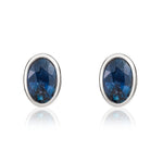 9ct White Gold Oval Natural Sapphire Rubover Stud Earrings — 6x4mm