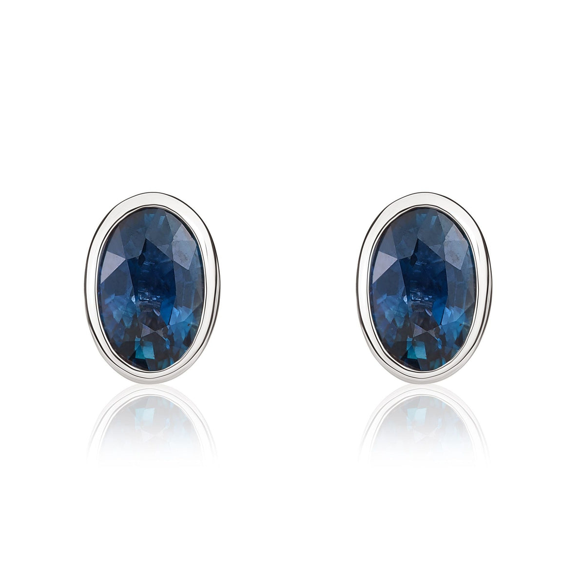 9ct White Gold Oval Natural Sapphire Rubover Stud Earrings — 6x4mm