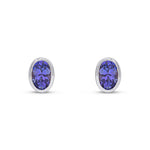9ct White Gold Oval Natural Tanzanite Rubover Stud Earrings — 6x4mm