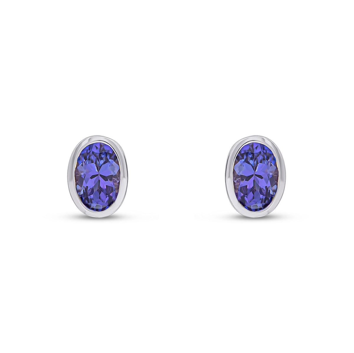 9ct White Gold Oval Natural Tanzanite Rubover Stud Earrings — 6x4mm