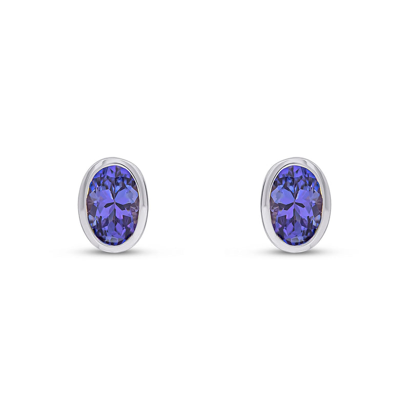 9ct White Gold Oval Natural Tanzanite Rubover Stud Earrings — 6x4mm