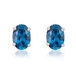 9ct White Gold Oval Natural London Blue Topaz Claw Stud Earrings — 7x5mm