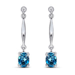 9ct White Gold Oval Natural London Blue Topaz Claw Bar Drop Earrings — 7x5mm