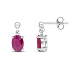 9ct White Gold Oval Natural Ruby Claw Drop Earrings — 7x5mm