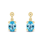9ct Yellow Gold Oval Natural Swiss Blue Topaz Claw Drop Earrings — 7x5mm