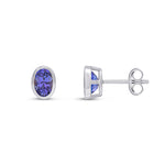 9ct White Gold Oval Natural Tanzanite Rubover Stud Earrings — 6x4mm