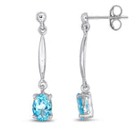 9ct White Gold Oval Natural Swiss Blue Topaz Claw Bar Drop Earrings — 7x5mm